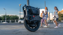 Leaperkim Veteran Sherman-L electric unicycle, front three-quarter view in the city
