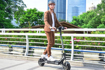Man riding the VIPCOO VS6 electric scooter in the city