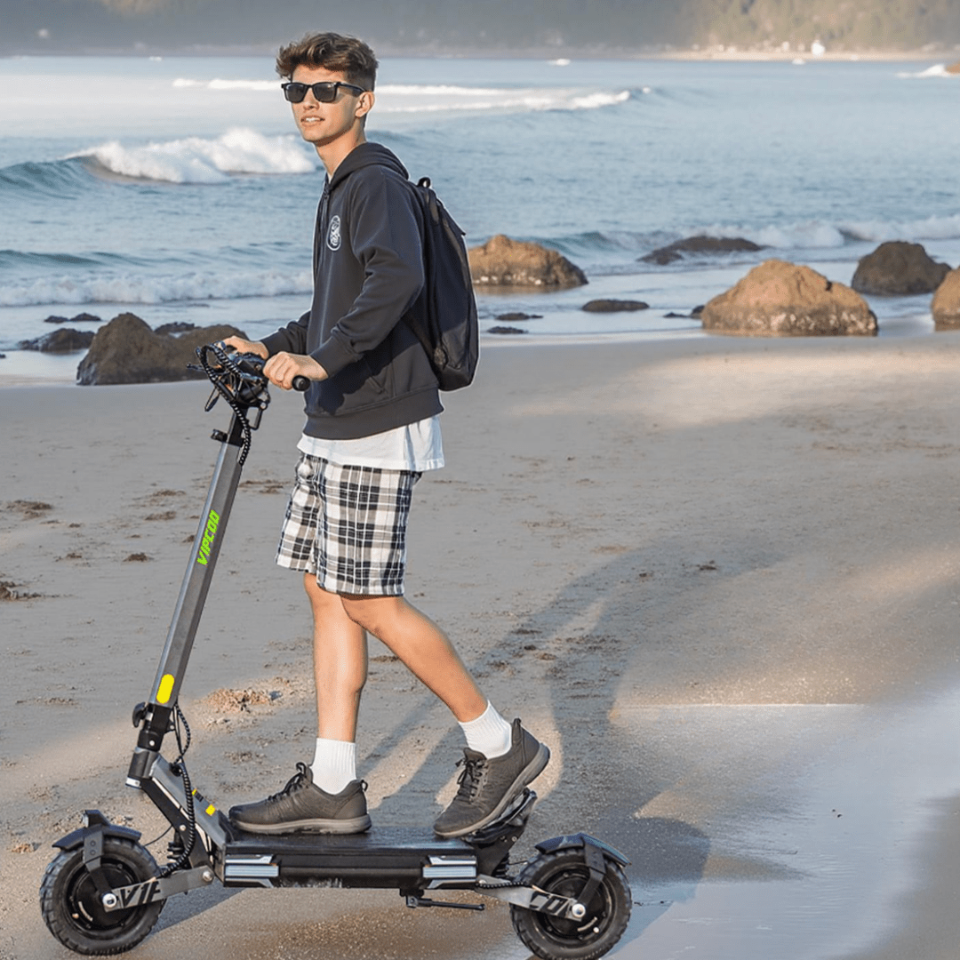 Man riding the VIPCOO VS6 electric scooter by the sea