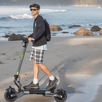 Man riding the VIPCOO VS6 electric scooter by the sea