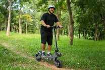 Man standing with the VIPCOO VS9 electric scooter in a park
