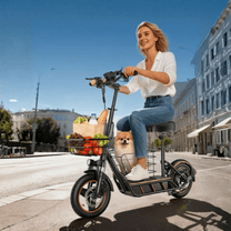 Woman riding the Wheely H14 electric scooter in the city