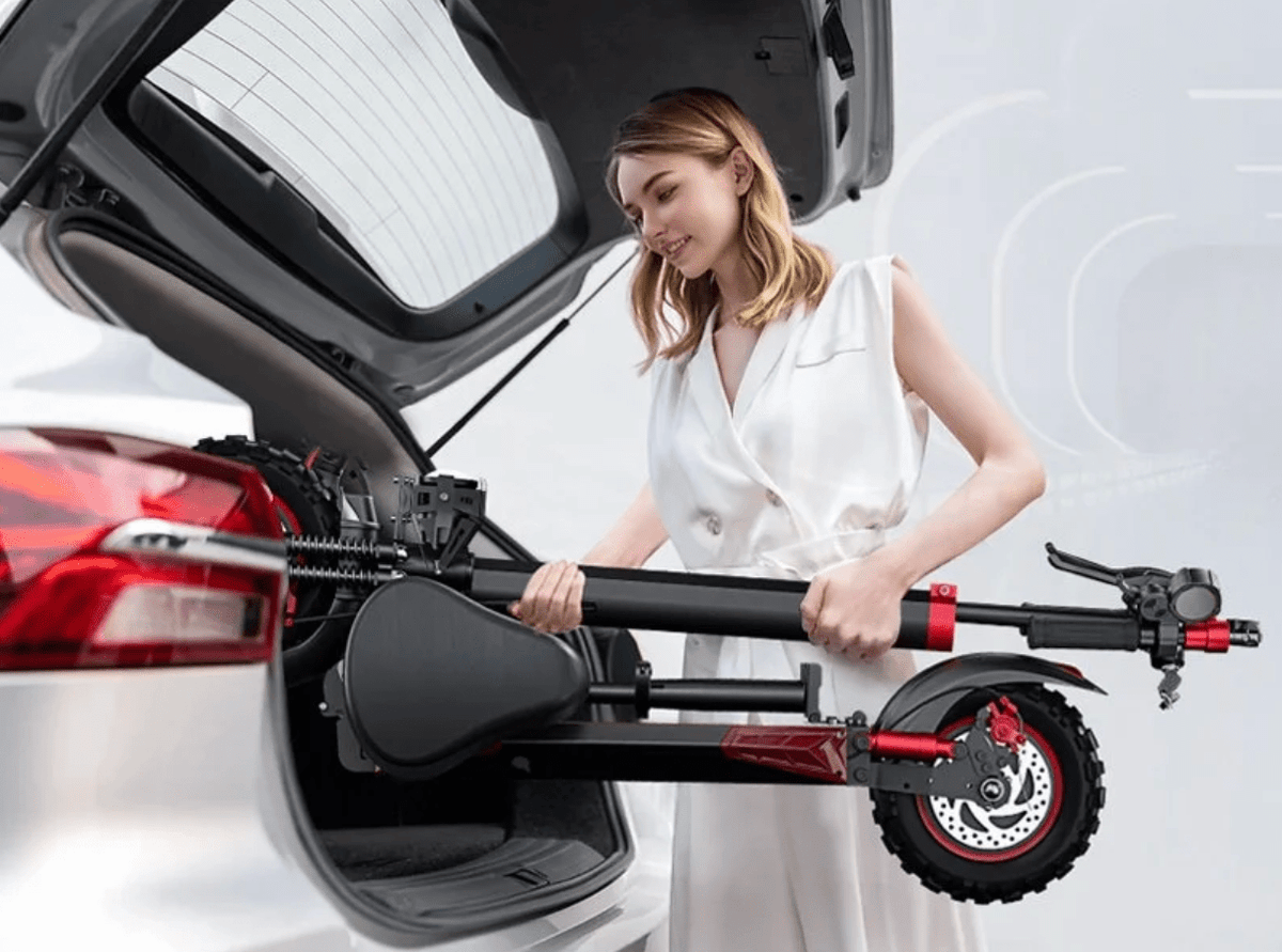 Woman standing with the Wheely J11 Max electric scooter