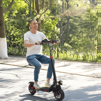 Man sitting on the Wheely J11 Max electric scooter