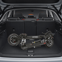 Folded Wheely N3L Max electric scooter in a car boot
