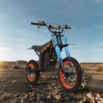 Wheely Y01 electric dirt bike, front three-quarter view on sandy ground