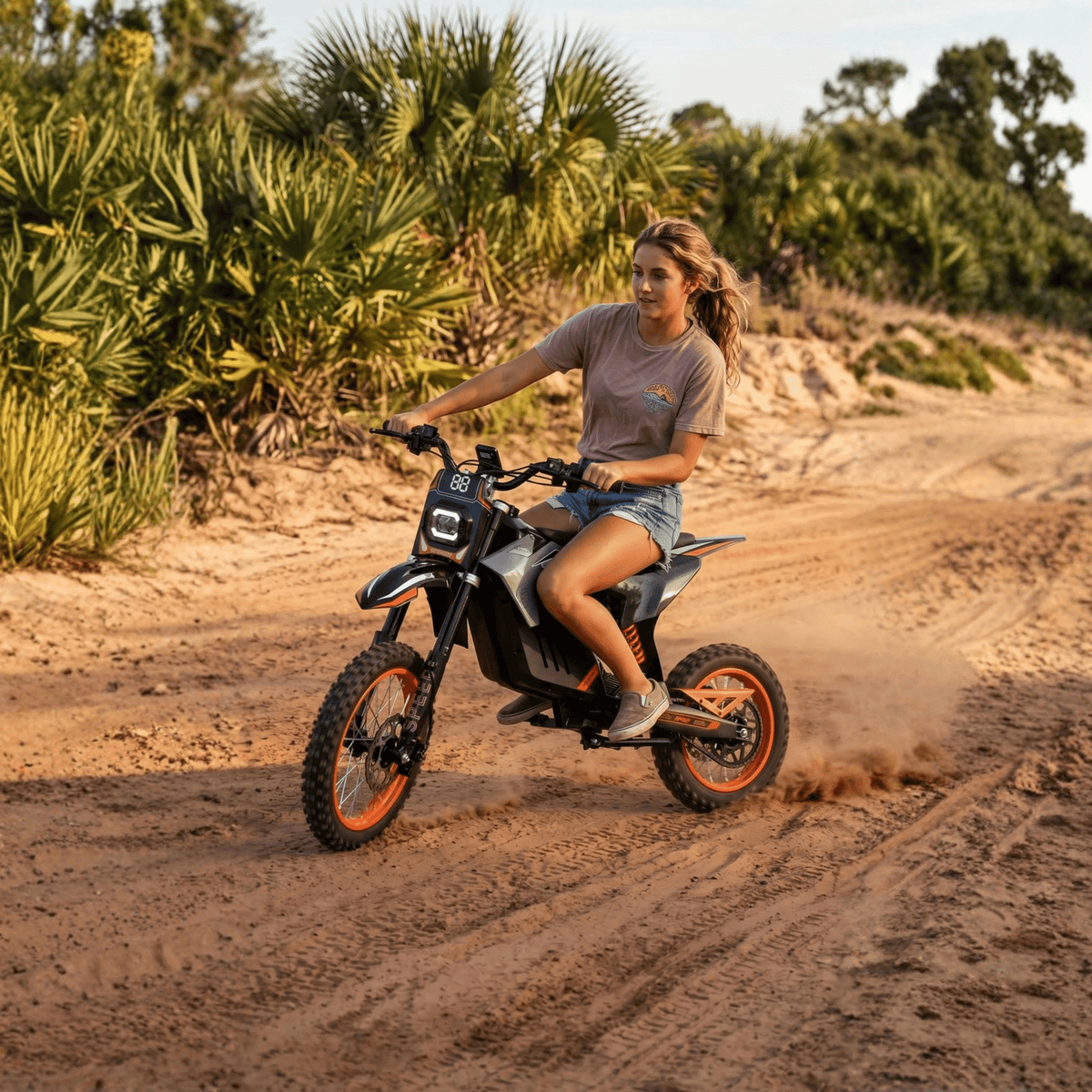 Person riding the Wheely Y88 electric dirt bike on a footpath