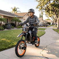Person riding the Wheely Y88 electric dirt bike in a park