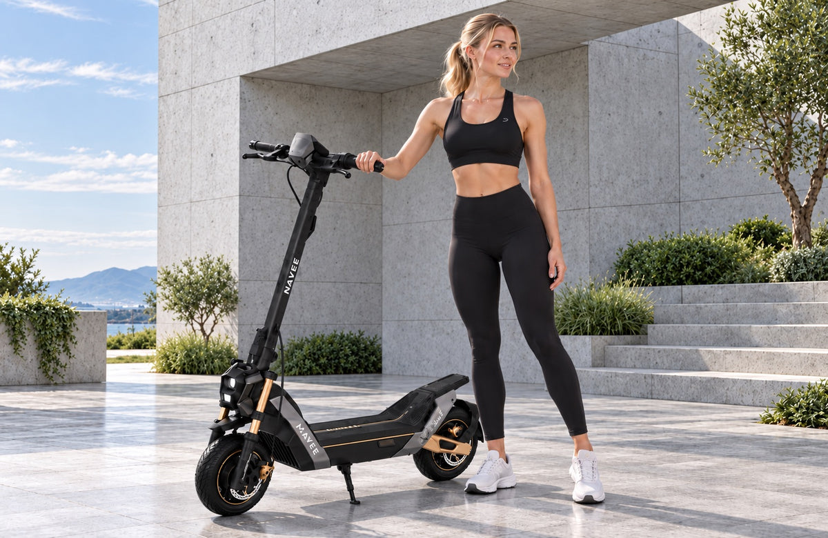 Woman with a NAVEE electric scooter outside a modern concrete building – no combustion engine, no exhaust, powered by electricity