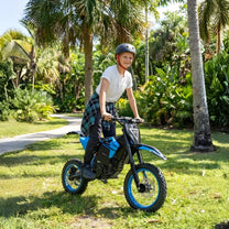 Person standing with the ZAWES S3 electric dirt bike on a grassy field