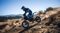Rider taking the ZAWES S3 electric dirt bike off-road in the mountains